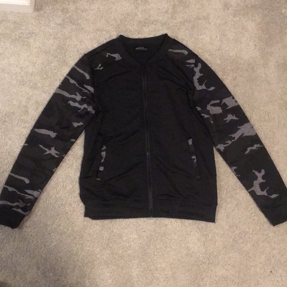 black zip down sweater with camo sleeves